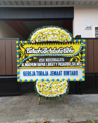 Papan Bunga Duka di Gonda Baru